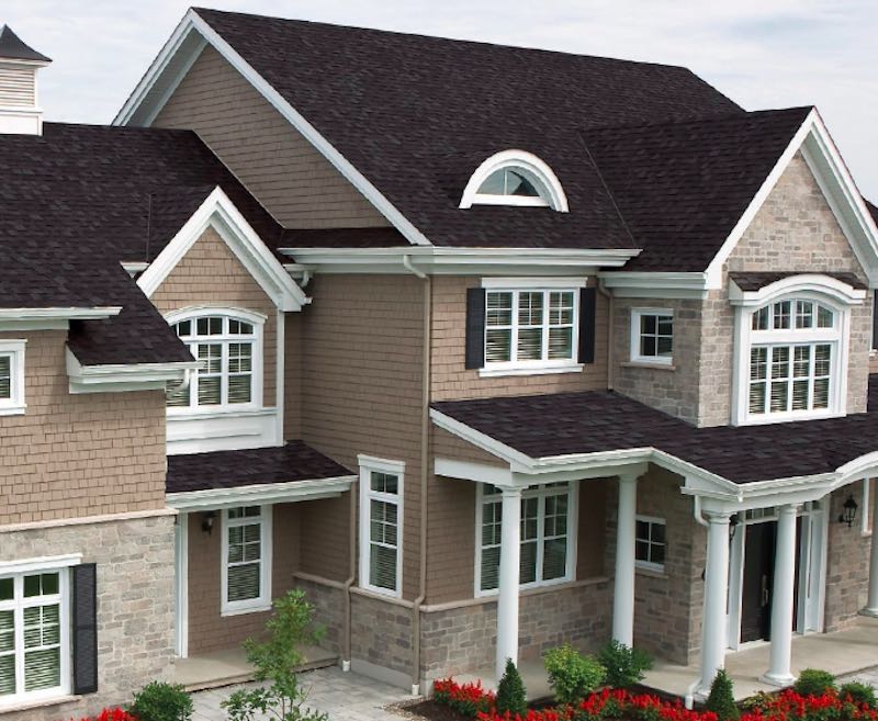 Black shingle roof with brown siding on a house in northern Indiana