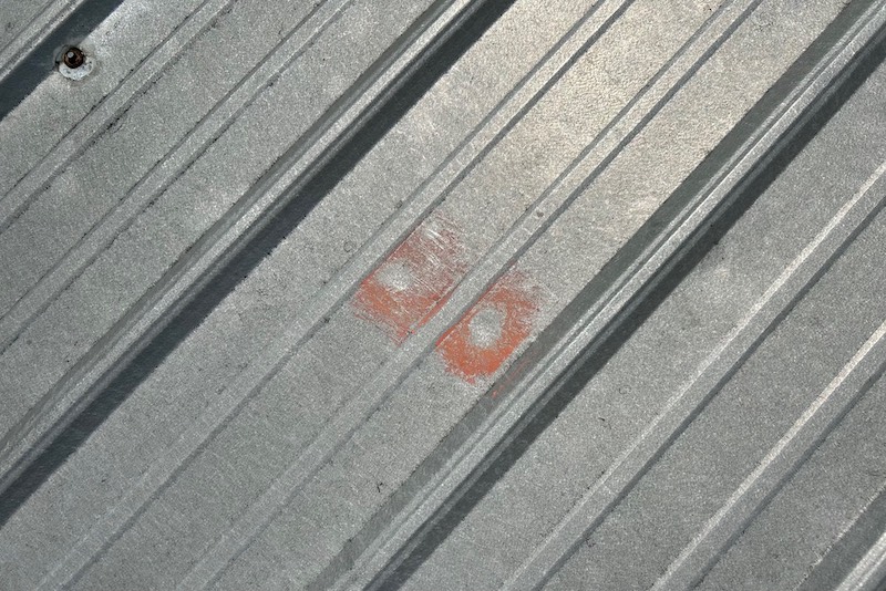 hail damage on metal roof in northern Indiana