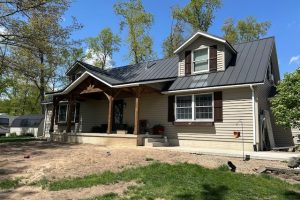 timber porch with black metal roof